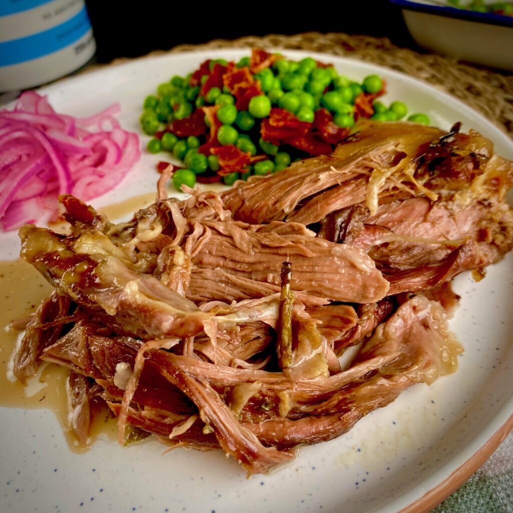 Slow Cooked Lamb Shoulder on plate with sides