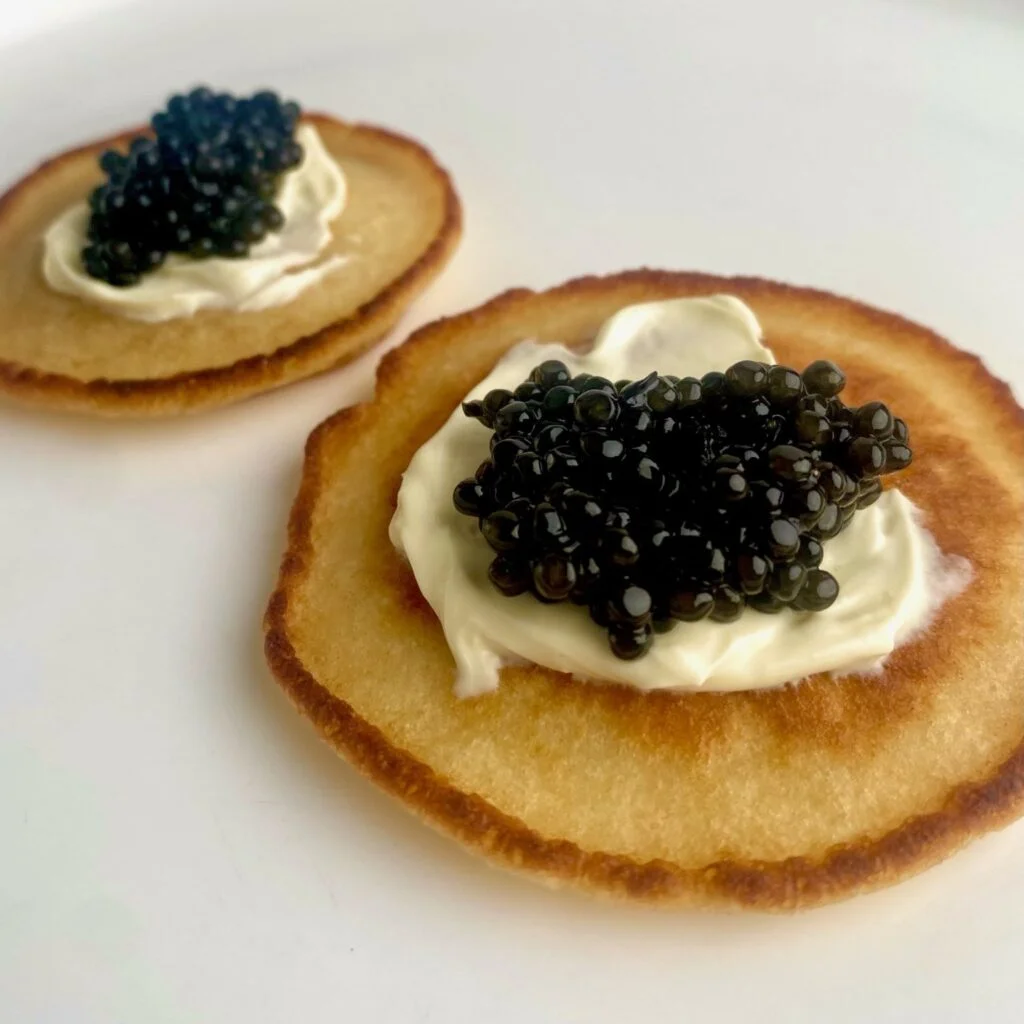Caviar Bump with Blinis close up