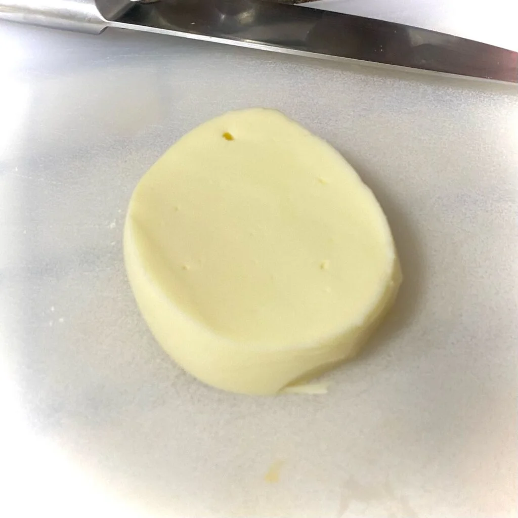 Mozzarella Cheese cut into small hockey puck shapes