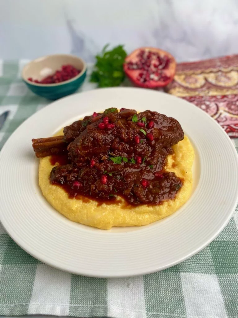 Braised Lamb Shanks with Grits and Pomegranate seeds