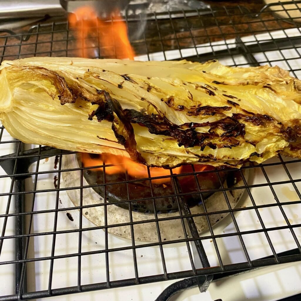Cabbage roasting on gas burner