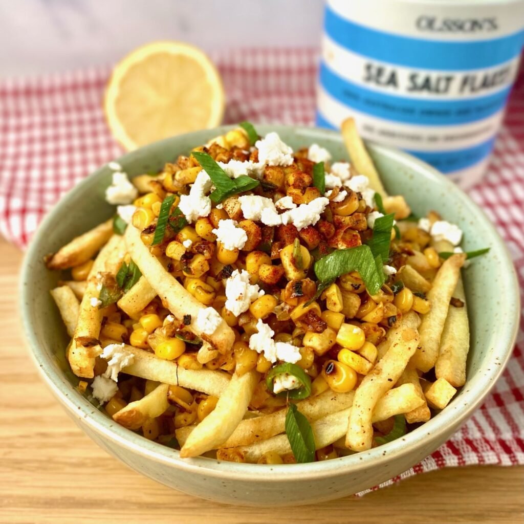 Garnishing Elote Fries
