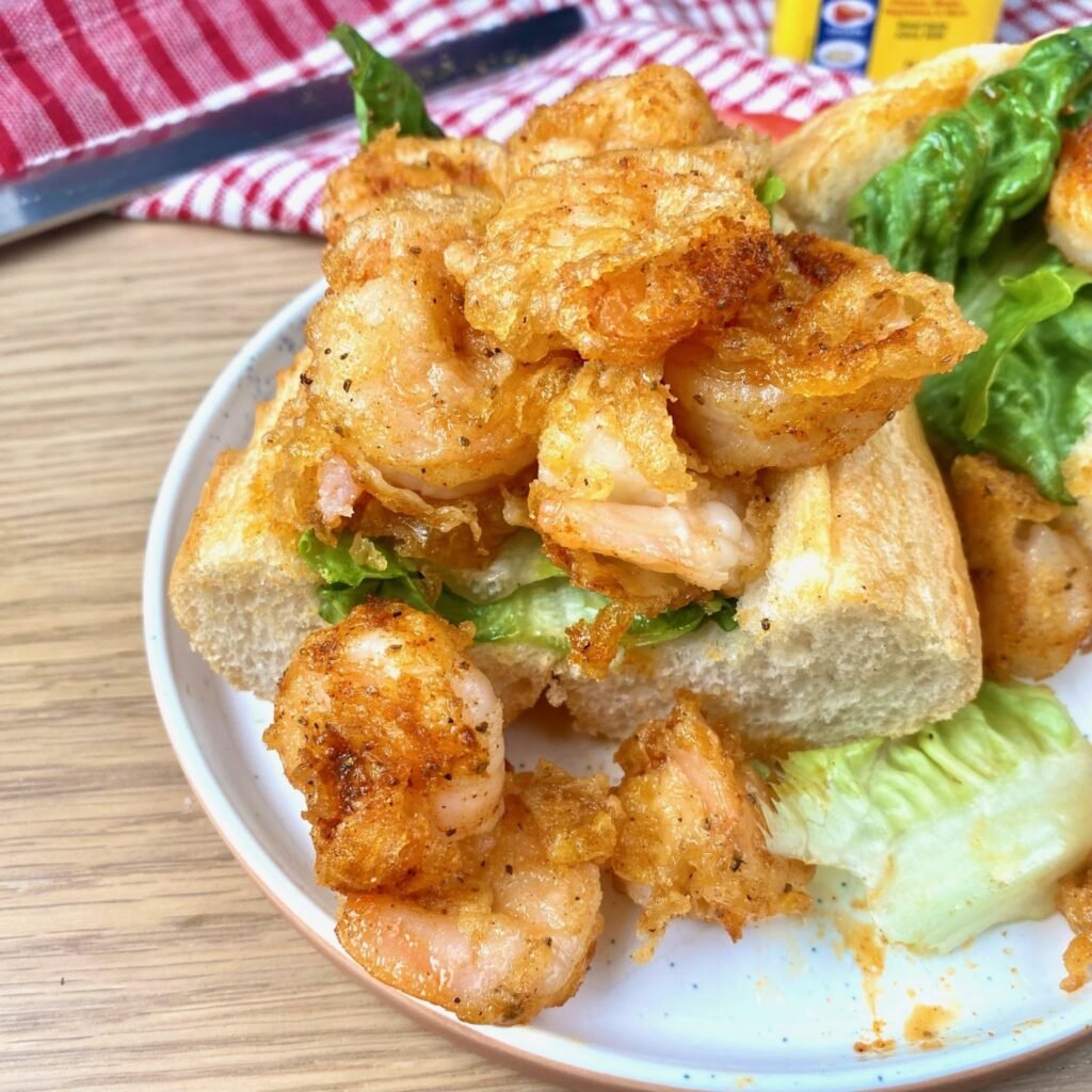 Assembling Tempura Shrimp Po Boy Sandwich